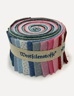 Rolled bundle of colorfully patterned fabric strips tied with a beige ribbon labeled Westfalenstoffe.