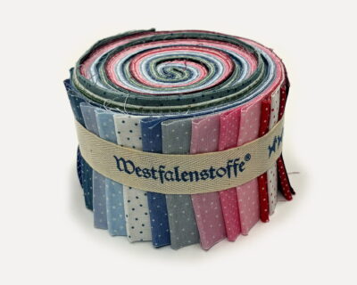 Rolled bundle of colorfully patterned fabric strips tied with a beige ribbon labeled Westfalenstoffe.