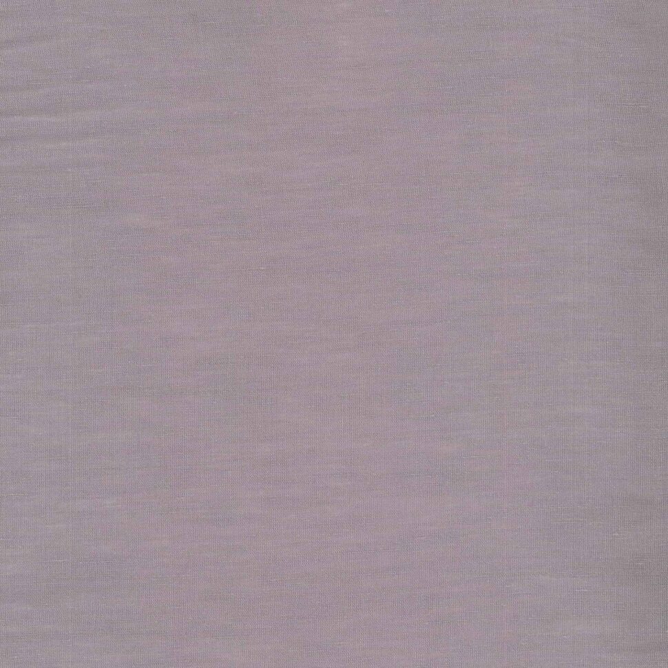 Close-up of light pink fabric with a subtle woven texture