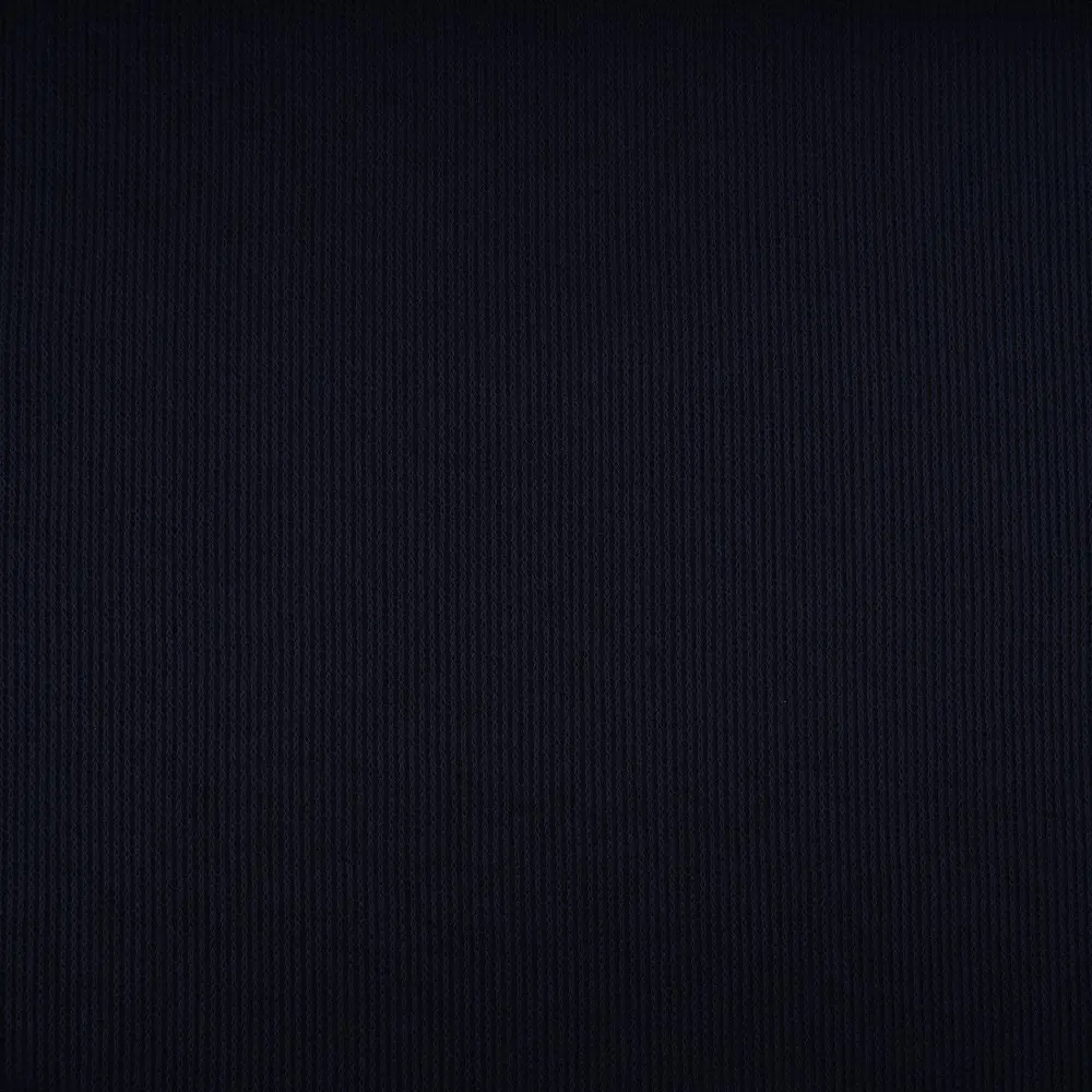 Close-up of dark navy ribbed fabric texture across the surface with fine vertical lines