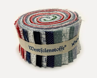 Rolled fabric bundle with multiple sewn strips in blue, red, and green patterns bound by a beige strap.