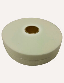 Close-up of a white adhesive tape roll on a pale background, seen from above with a brown center core.