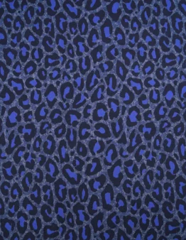 Blue leopard print pattern with irregular dark spots on a textured blue background, used as a decorative pattern.