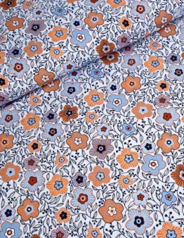 Patterned fabric with orange, blue, and navy flowers and dark vines on a white background (floral print)