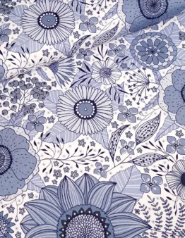 Blue and white floral fabric pattern with large blossoms and detailed leaves, in navy and light blue tones.